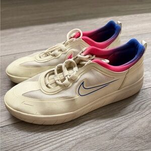 Nike Beige Sneakers with Pink and Blue Highlights
